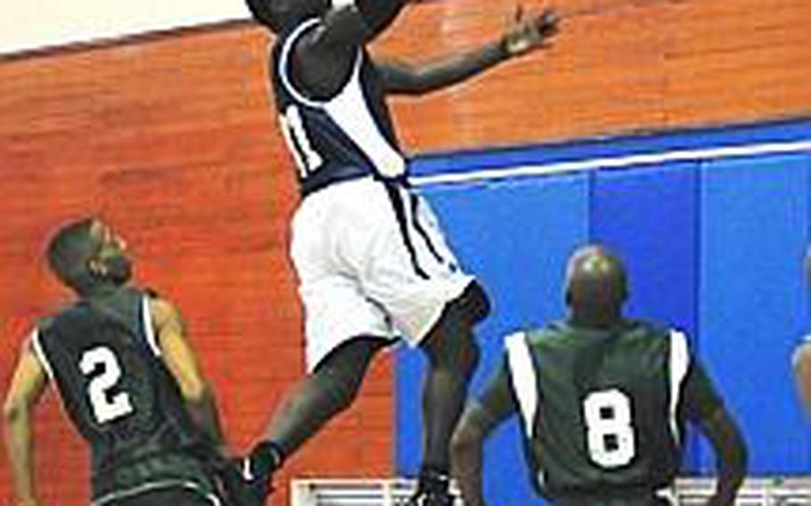 Jacori Zephyr from United States Naval Hospital Camp Lester leaps toward the basket for two points. Sixth seed USNH went on to upset third seed 3rd Marine Division, 79-65, to reach the semifinals of the Marine Corps Far East Regional Basketball Tournament.