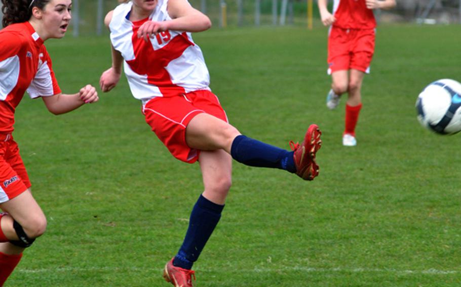 Aviano's Madeline O'Brien sends the ball toward the goal Saturday during the opening weekend of the DODDS-Europe spring sports season. O'Brien scored on the play and the Saints topped American Overseas School of Rome, 5-2.