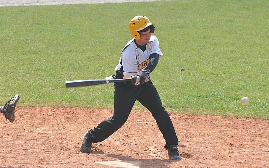 Vicenza's Johnny Suero swings at an oncoming pitch Friday in the Cougars' 12-11 loss to Naples. The two schools opened their season with a double-header Friday, with two more games - against different competition - set for Saturday.