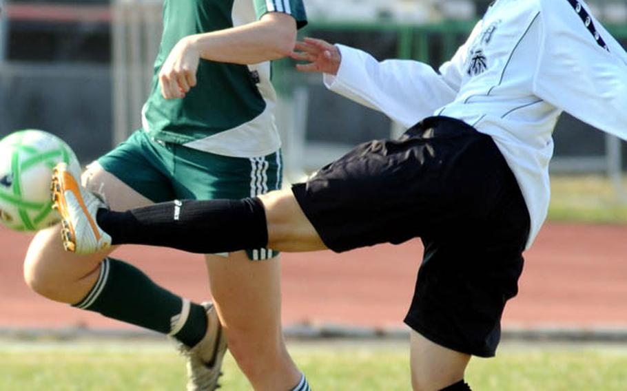 Elizabeth Fabila of Kubasaki tries to settle the ball against Konomi Nikawadori of Urasoe during Saturday's high school girls soccer match at Kubasaki High School,  Okinawa. Kubasaki won, 4-1.