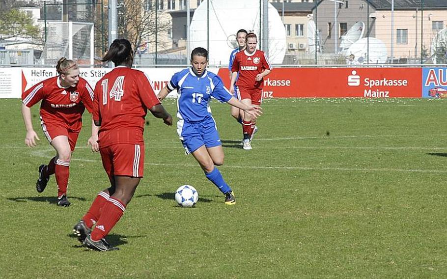 Wiesbaden senior Celina Ponte tries to shake off Kaiserslautern defenders at the Stadion In der Witz in Mainz-Kastel, Germany. Although Ponte scored two goals for the Lady Warriors, Kaiserslautern won the match, 5-3.