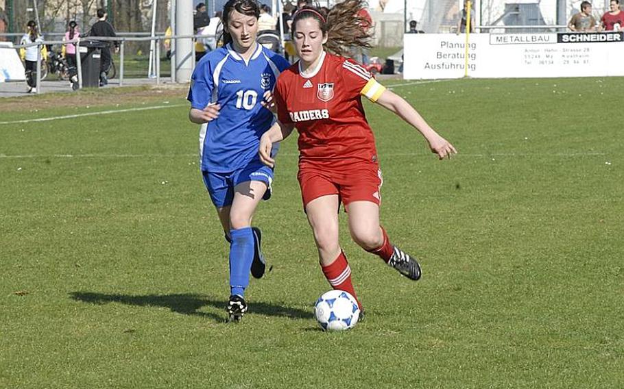 Kaiserslautern senior Olivia McQuail tries to keep the ball ahead of Wiesbaden junior Andrea Arnold during the first half of their game at the Stadion In der Witz in Mainz-Kastel, Germany.  The Lady Raiders went on to win, 5-3, as McQuail scored two goals.