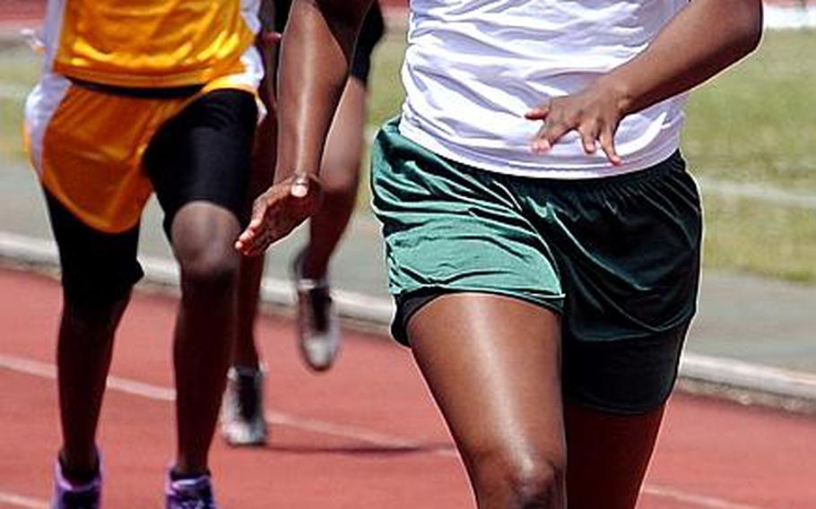 Kubasaki's Bianca Johnson leads the pack home in the girls 200-meter final during Saturday's Okinawa Relays at Kubasaki High School, Okinawa. Johnson won in 27.08 seconds.