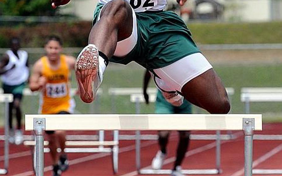 Kubasaki's Jalah Patten negotiates the last hurdle in the boys 300-meter hurdles final during Saturday's Okinawa Relays at Kubasaki High School, Okinawa. Patten won in 43.58 seconds.
