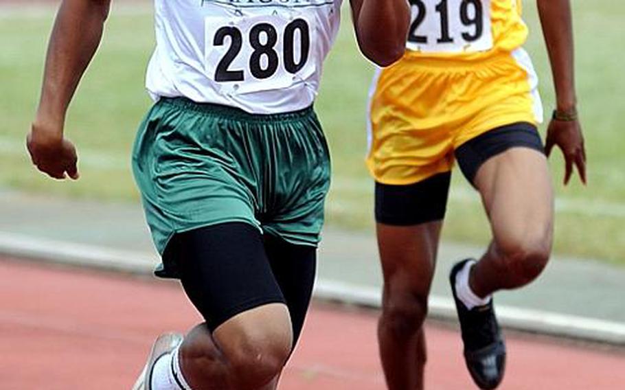 Kubasaki's A.J. Watson leads Kadena's Derrick Taylor in the home stretch of the boys 400-meter final during Saturday's Okinawa Relays at Kubasaki High School, Okinawa. Watson won in 51.55 seconds.