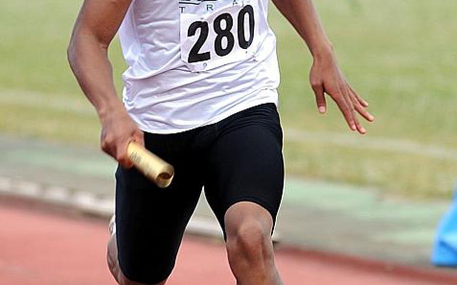 Kubasaki's A.J. Watson pounds for home in the boys 400-meter relay during Saturday's Okinawa Relays at Kubasaki High School, Okinawa. Watson anchored Kubasaki's A team to victory in 44.58 seconds.