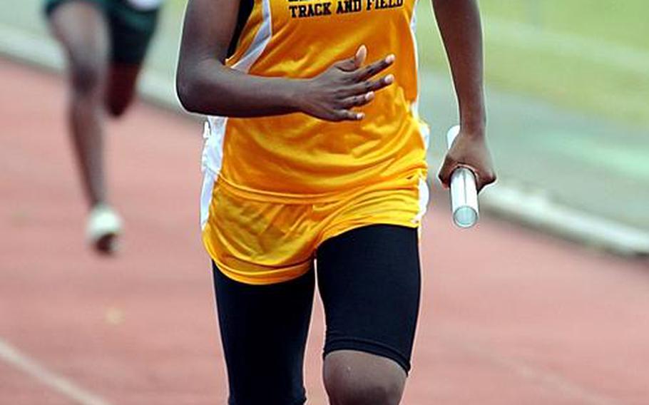 Kadena's Janika Caines leads the pack down the home stretch of the girls 400-meter relay during Saturday's Okinawa Relays at Kubasaki High School, Okinawa. Caines anchored Kadena's A team to victory in 55.14 seconds.