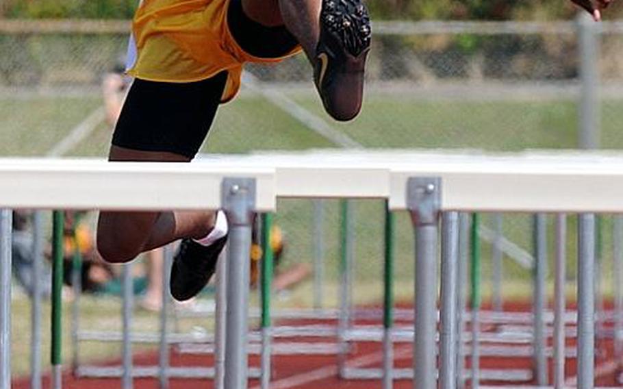 Kadena's Derrick Taylor negotiates the boys 110-meter hurdles during Saturday's Okinawa Relays at Kubasaki High School,  Okinawa. Taylor won in 16.68 seconds.