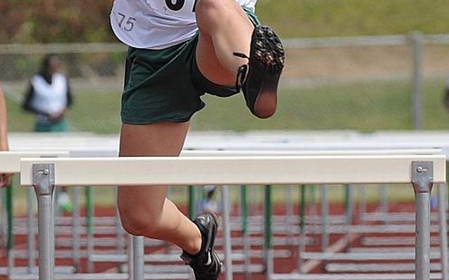 Kubasaki's Micaela Sherman leaps the final hurdle in the girls 100-meter hurdles final during Saturday's Okinawa Relays at Kubasaki High School, Okinawa. Sherman won in 17.34 seconds.
