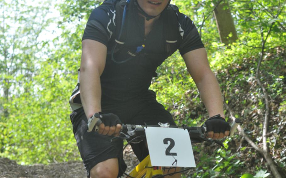 Derrick Bartter of Ghedi Air Base in Italy coasts while descending from a small climb Saturday in the first leg of the U.S. Forces in Europe mountain bike series on a course near Aviano Air Base, Italy.