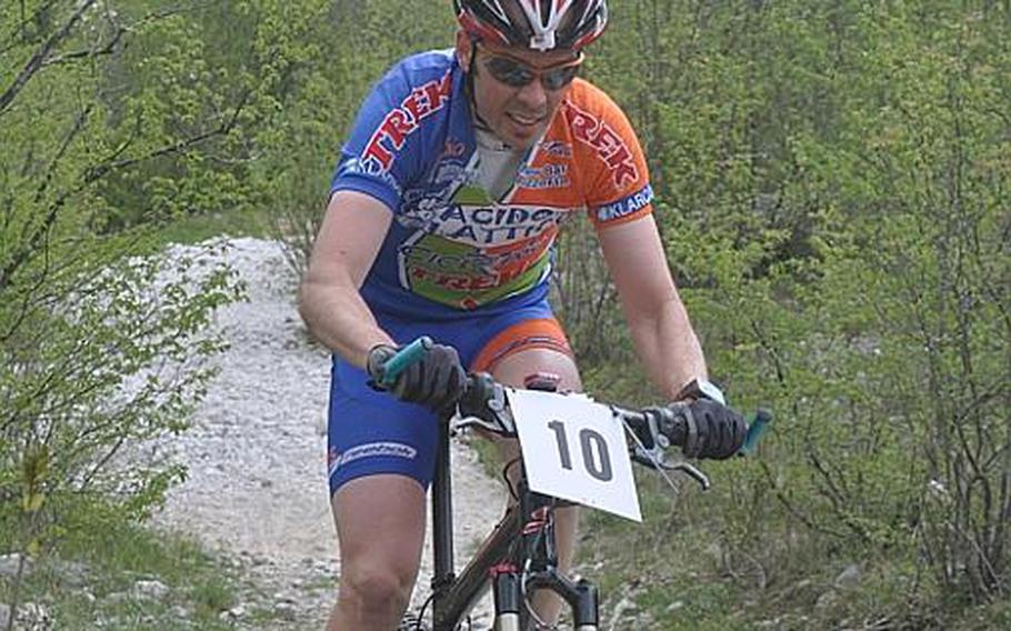 Adam Leigland of Aviano pushes through a rocky part of the mountain bike course Saturday during the first leg of the U.S. Forces in Europe mountain bike series. Leigland, a 38-year-old civilian based at Aviano, won the race for the second year in a row, this time in 1 hour, 37 minutes and 11 seconds.