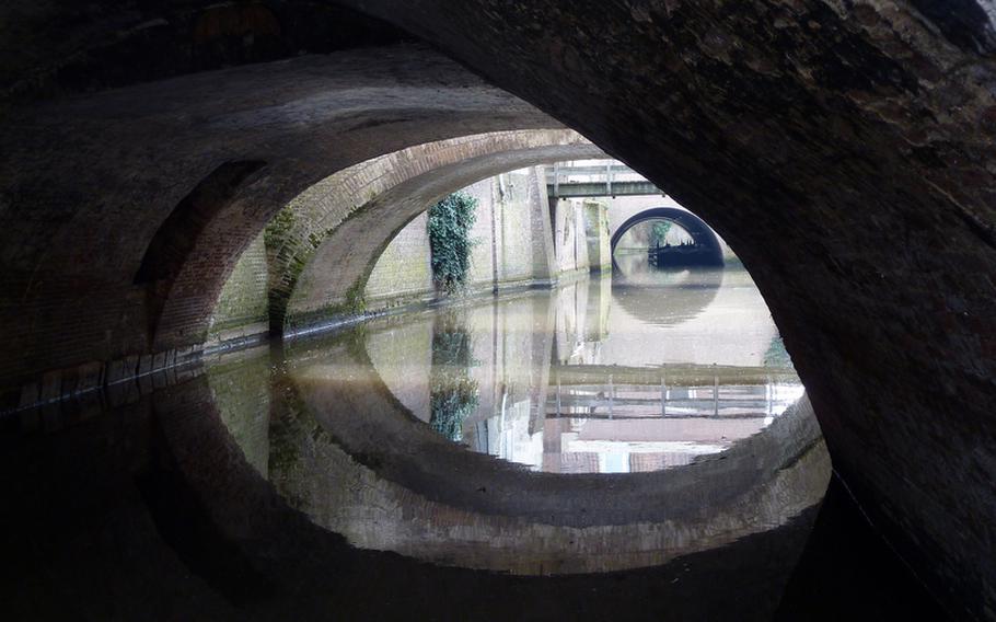 Numerous ?s Hertogenbosch bridges are reflected in the Binnendieze, a waterway that runs through and under the town.