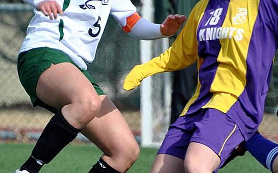 Daegu American senior soccer midfielder Angie Robinet, left, signed a national letter of intent in December for a partial scholarship to Point Park (Pa.) College, an NAIA school in Pittsburgh.