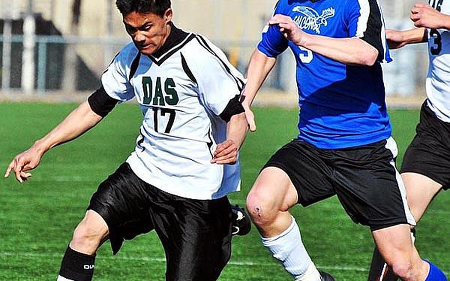 Peter O'Grady, right, battling Daegu American's Ryan Banzon for the ball, is a veteran on a Seoul American Falcons boys soccer team that began this season 0-3 but has gone 5-2-3 since, including a four-match win streak, and has made them one of six teams atop Korean-American Interscholastic Activities Conference Division I with a good chance to win the league's championship tournament this weekend at Osan American High School.