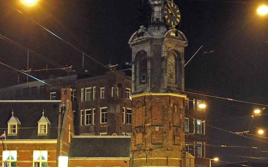 The Munttoren, or Mint Tower, in Amsterdam was built in 1672 and was once part of the city walls. Three of Amsterdam's shopping streets start here and the city's flower market is next door.