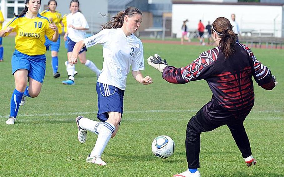 Heidelberg's Melissa Frye goes around Bamberg goalie Heather Smith to score a goal in the Lady Lions' 8-1 win over Bamberg on Friday afternoon. At left is Bamberg's Carrie Bentley.