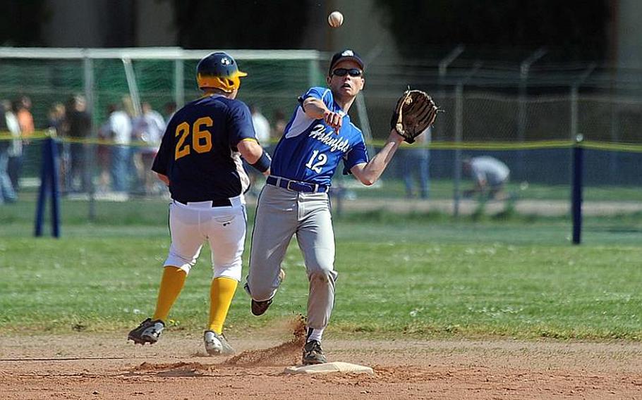 Rene Bourgeois of Hohenfels tries to turn a double play after forcing out Heidelberg's Caelen Allmon at second base. Bourgeois' efforts were for naught as Heidelberg swept Hohenfels, 16-1, 18-1 in a doubleheader in Heidelberg on Saturday.