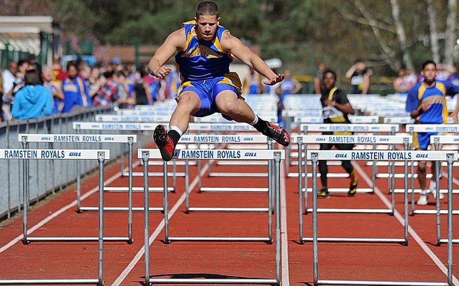 Wiesbaden's Kenyatta Hill crosses the final hurdle in a 110-meter race in Ramstein on April 2. This year he has added the shot put and discus to the sprints, hurdles and relays he also competes in.