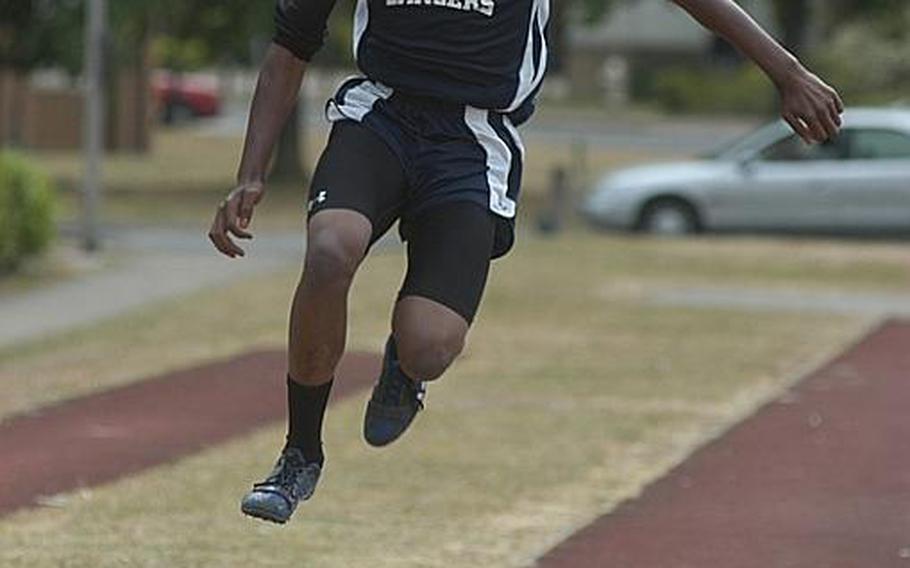 Lakenheath sophomore Albert Jones III soars with his first leap in the triple jump during a track meet at RAF Lakenheath, England. Jones jumped 38 feet, 2 inches, good enough to win the meet but not to qualify for the European championships.