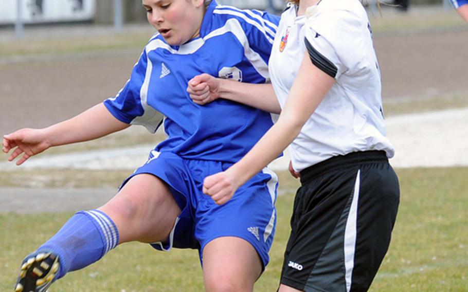Alexandra McVicker, left, of Brussels tries to get past AFNORTH's Macy Hinds in a game won by AFNORTH 4-2. Both teams are seeded second in their respective tournaments:  Brussels in Division III and AFNORTH in Division II.