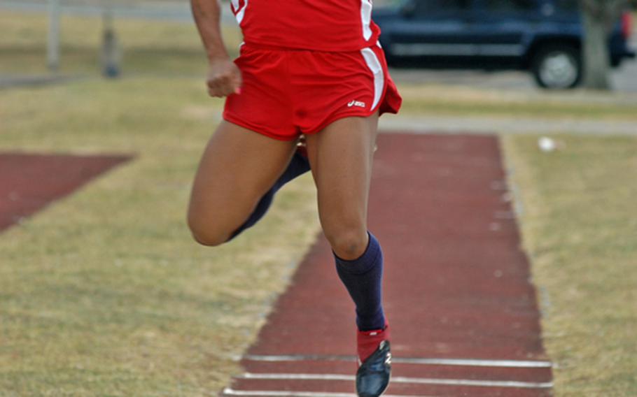 Senior Jasmin Walker spots her landing during the triple jump field event on  May 14 at RAF Lakenheath, England. Walker is the defending DODDS-Europe girls champion in the event.
