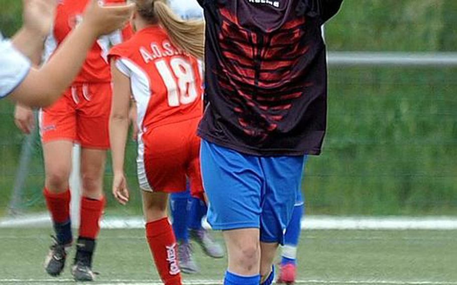 Bamberg goalie Hanna Fellinger celebrates her game-winning free kick against American Overseas School of Rome in Division II action on Thursday. She had switched from her midfield position to goalkeeper with the score tied 1-1, a short time earlier. She took the free kick from a good 30 yards out, and the ball found its way into the goal for the 2-1 win.