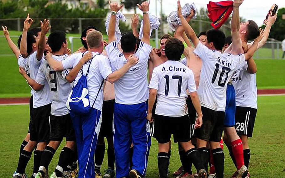 Seoul American's players celebrate after Friday's championship match in the 2011 Far East High School Boys Division I Soccer Tournament at Camp Foster, Okinawa. The visiting Falcons edged the Kubasaki Dragons, 1-0, in double-overtime.