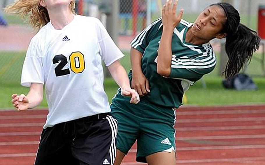 American School In Japan's Julie Keese and Kubasaki's Angelica Juliano battle for the ball during Friday's championship match in the 2011 Far East High School Girls Division I Soccer Tournament at Camp Foster, Okinawa. The visiting Mustangs edged the host Dragons, 1-0, for the second title in ASIJ school history.