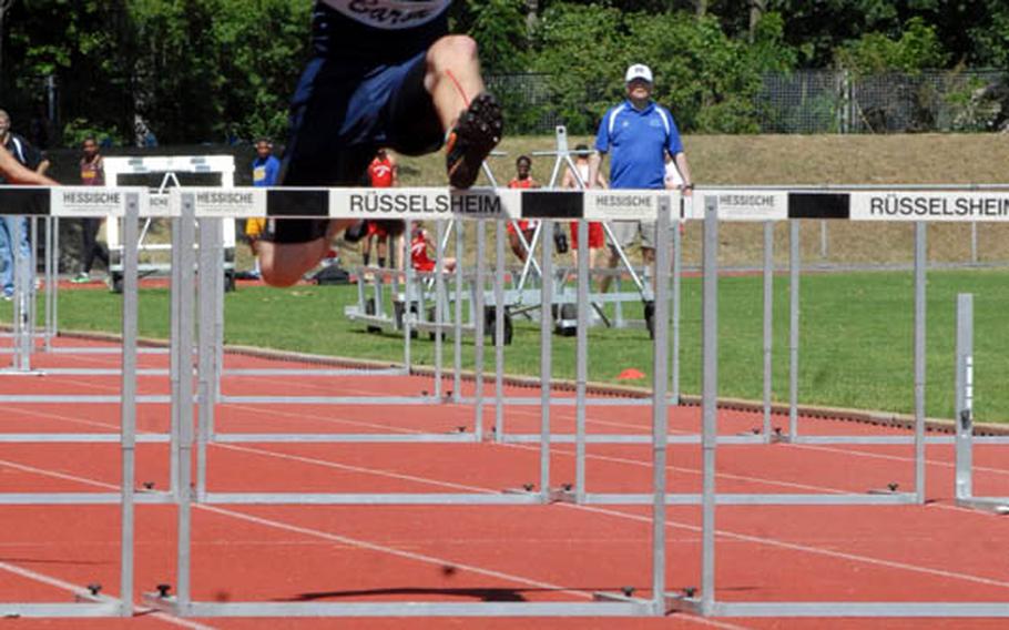 Bitburg junior LJ Downey clears a hurdle during the preliminaries of the boys 110 meter hurdles at the 2011 DODDS-Europe Track and Field Championships in Russelsheim, Germany.