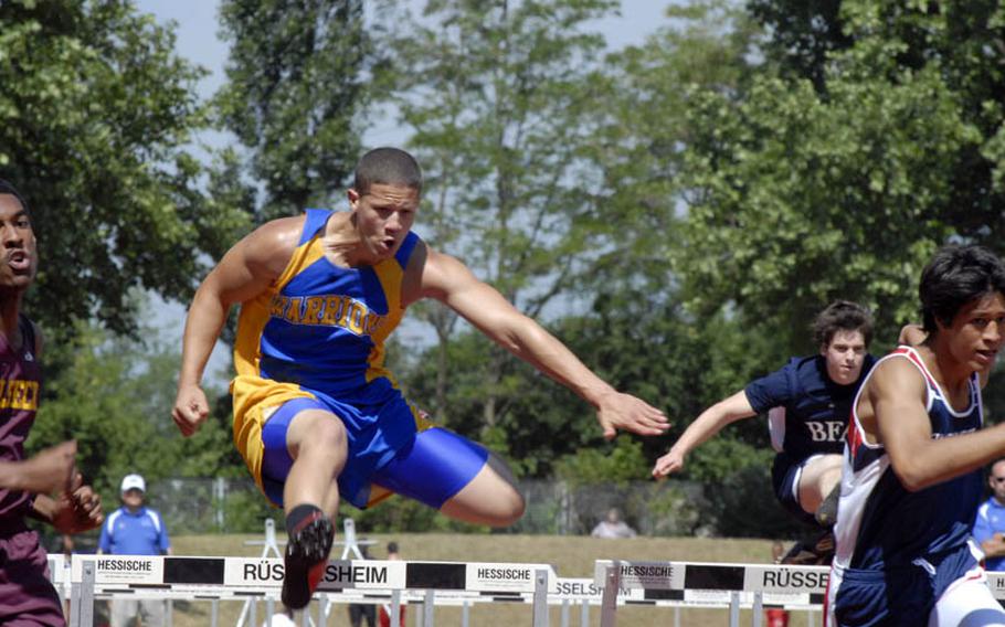 Wiesbaden senior Kenyatta Hill clears a hurdle during a prelim heat of the boys 110 meter hurdles at the 2011 DODDS-Europe Track and Field Championships in Russelsheim, Germany.  The two-day meet concludes Saturday.