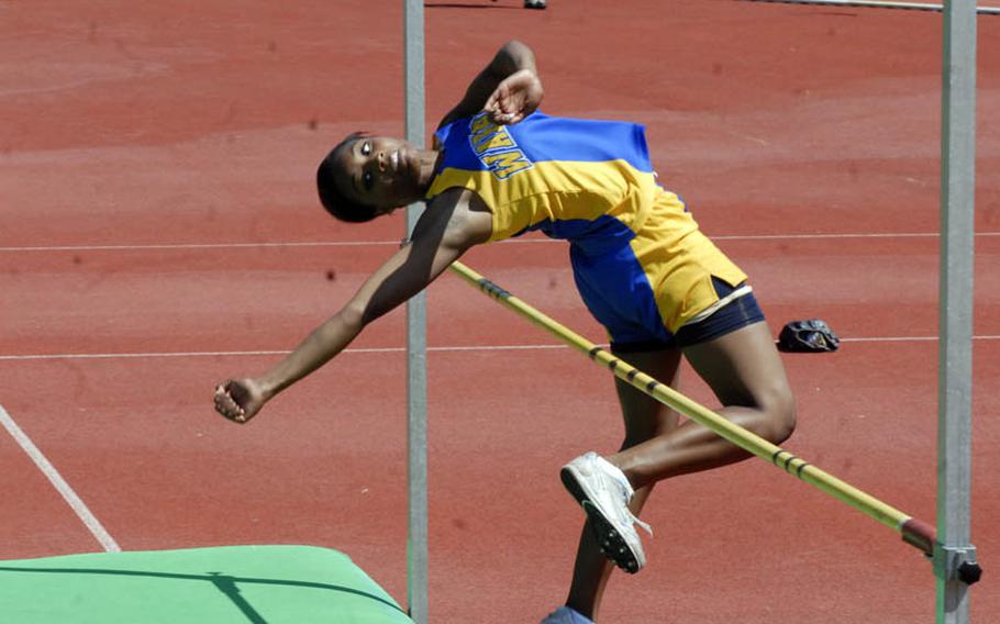 Wiesbaden senior Kelley Colbert clears the bar during the championships of the girls high jump at the 2011 DODDS-Europe Track and Field Championships in Russelsheim, Germany.  Colbert finished in third place behind Ramstein senior Tara Lookabaugh, who cleared 5 feet 4 inches, and runner-up Alayna Hubner, a Patch junior.