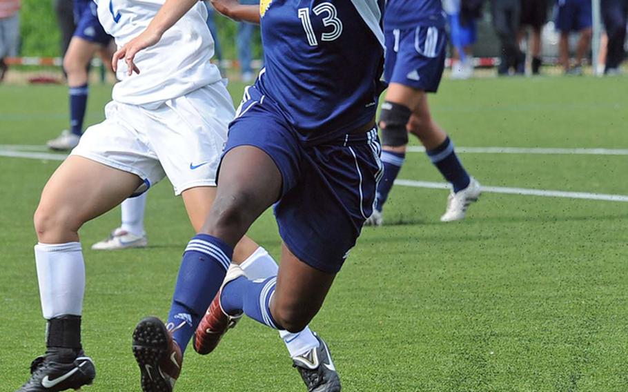 Ramstein's Josie Seebeck, left, and Heidelberg's Ashley Ross get tangled up fighting for a ball in a Division I girls soccer semifinal won by Ramstein, 5-0.