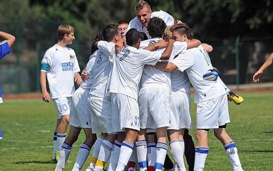 The Sigonella Jaguars celebrate their DODDS-Europe Division III soccer title after defeating Brussels, 2-0, in Ramstein on Saturday.