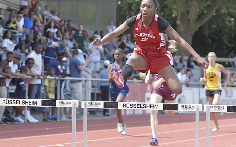 Kaiserslautern sophomore Ashley Santos clears the final hurdle en route to a first-place finish in the girls 300 meter hurdles at the 2011 DODDS-Europe Track and Field Championships in Russelsheim, Germany.   Santos finished with a time of 48.60 seconds; teammate Ruby Plummer finished second with a time of 49.75.