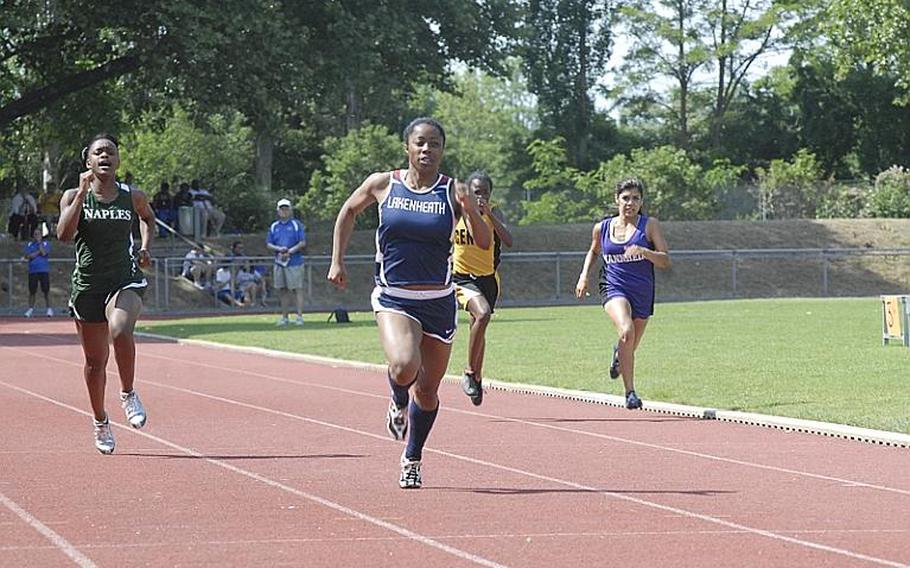 Lakenheath senior Jasmin Walker sprints ahead of, from left, Naples senior Jessica Edmondson, Vicenza freshman Ja'brea Joiner and Mannheim sophomore Grace Gonzalez,  to win the 200 meter run. Walker cruised to victory with a time of 25.60, one of four gold medals she won in the two-day DODDS Europe Track and Field Championships.