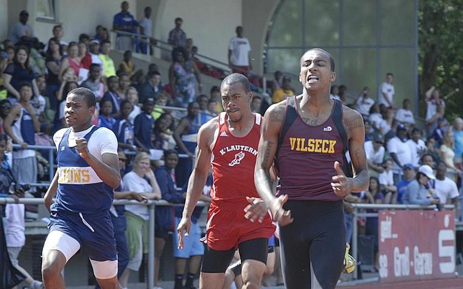 Vilseck senior Eddie Stokes, right, wins the boys 200 meter dash with a time of 22.57 seconds on the second day of the 2011 DODDS-Europe Track and Field Championships.  Also pictured are Heidelberg junior Deonte McMillan, who finished third, and Kaiserslautern senior Bernard Burwell, who finished in fourth place.  Stokes' teammate, senior Darius Whitehead finished second.