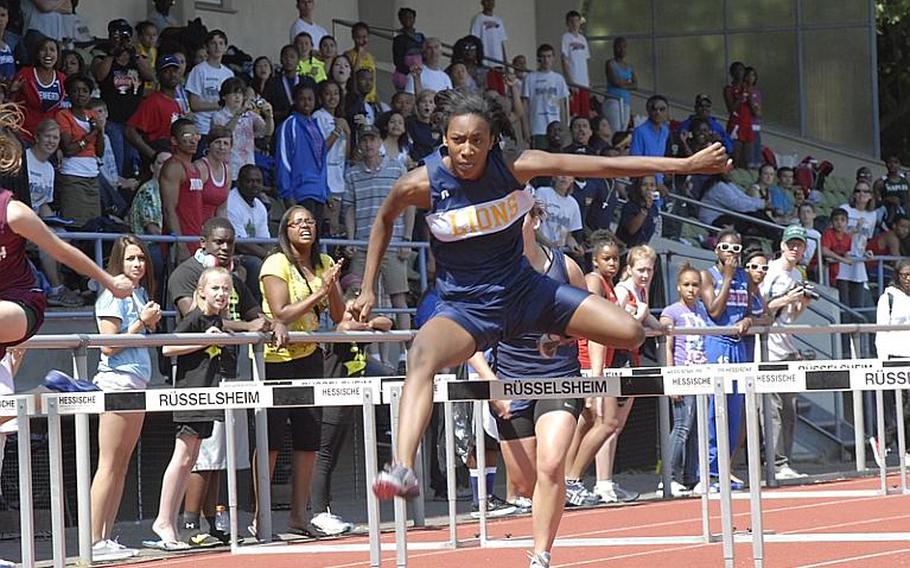 Heidelberg senior Veronique Henry clears a hurdle during the 100 meter hurdle race at  the 2011 DODDS-Europe Track and Field Championships in Russelsheim, Germany. Henry won the event with a time of 16.79 seconds.