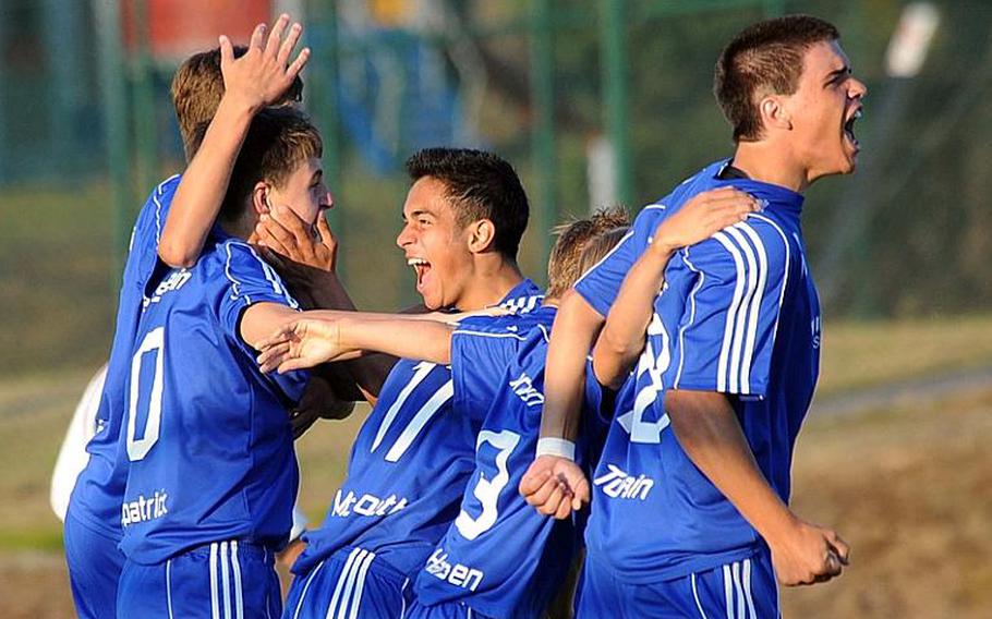 Ramstein players celebrate Andrew Fitzpatrick's goal against Lakenheath. It proved to be the decider as the Royals hung on to win, 2-1.