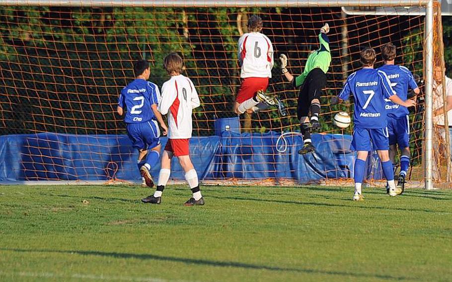 The ball sinks into the net over Ramstein goalie Kyle Borda for Lakenheath's lone goal in their 2-1 loss to Ramstein in the Division I championship game on Saturday.