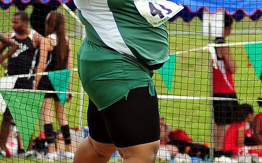 Kubasaki's Vallen Alleyne lets fly during the girls discuss event in Tuesday's finals of the 2011 Far East High School Track and Field Meet at Camp Foster, Okinawa. Alleyne defended her championship and broke her own meet record with a 28.82, capping an unbeaten season in both the discus and shot put.