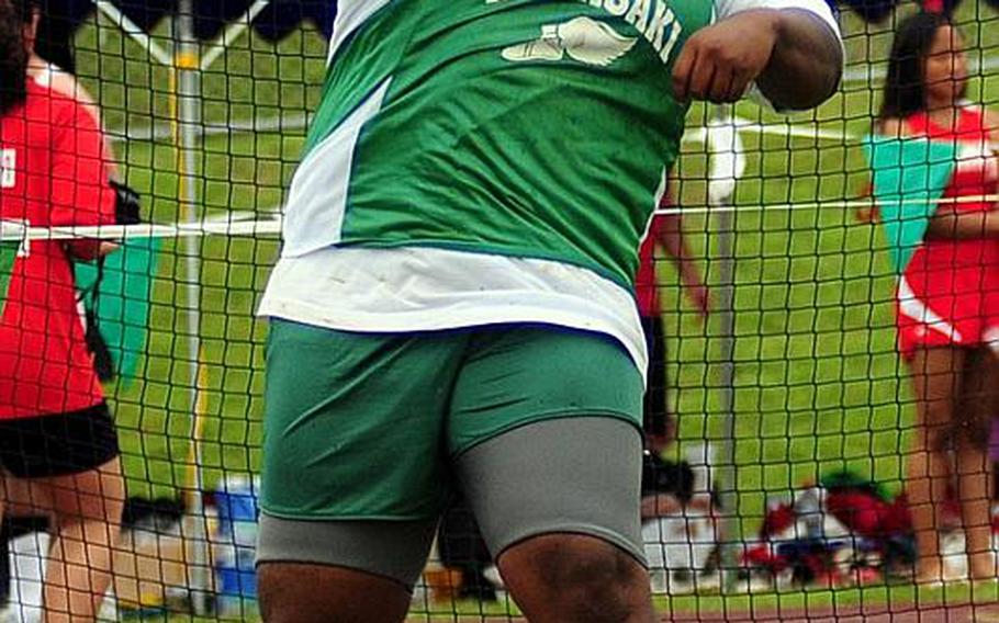Kubasaki's DeShawn Overton lets fly during the boys discuss event in Tuesday's finals of the 2011 Far East High School Track and Field Meet at Camp Foster, Okinawa. Overton finished sixth with a throw of 33.48 meters.
