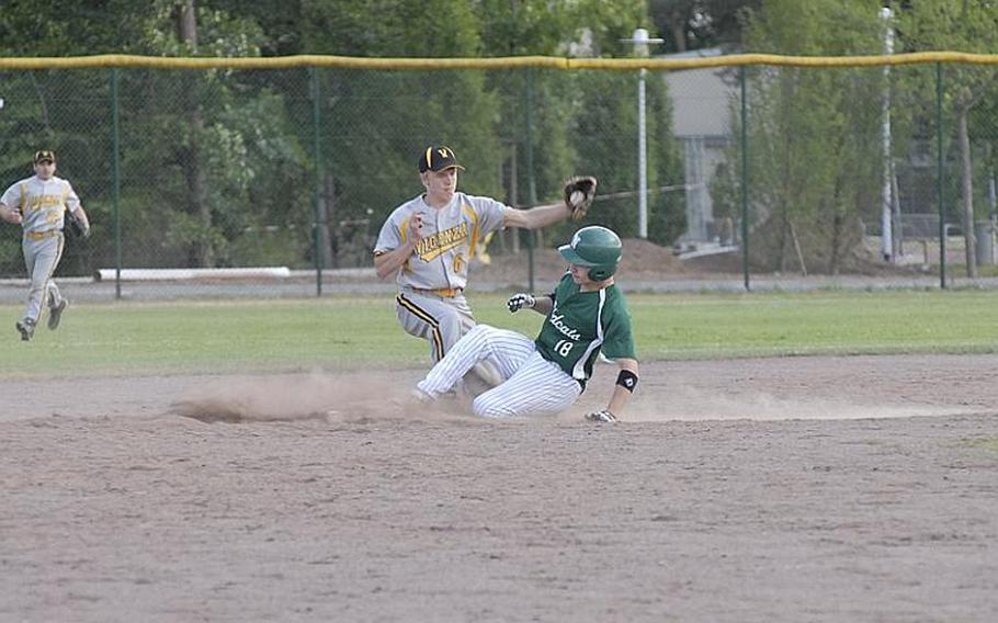 Naples senior Jonathan Bruce slides under the tag of Vicenza's Will Besuden during Friday's Division II baseball semifinal.  Vicenza rallied with 10 runs in the sixth inning to win  14-12 and advance to Saturday's final.