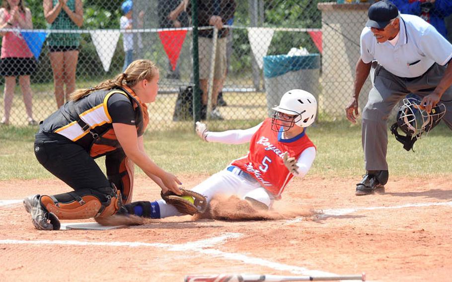 Patch catcher Jessica Rahn puts the tag on Ramstein's Caitlyn Modisette to keep a first-inning run from scoring. Patch beat Ramstein 8-2 for the Division I softball title.
