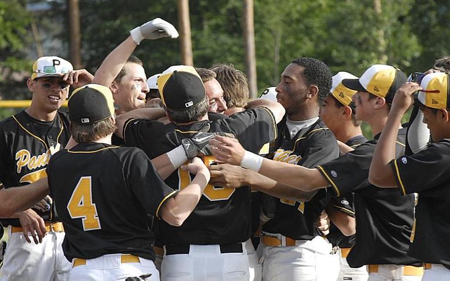 Patch players celebrate their 8-7 victory over Ramstein in the Division I baseball championships Saturday in Ramstein, Germany.