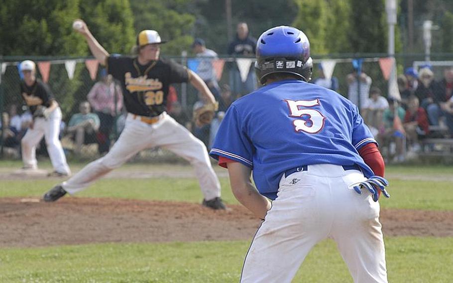 Ramstein senior Drew Grotelueschen adjusts his lead as Patch junior Dylan Measells delivers a pitch during Saturday's Division I championship game.  Patch defeated Ramstein, 8-7.