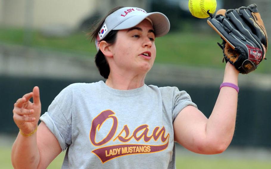 Osan Air Base pitcher Tava Blair can't find the handle on a popup by Kyungnam, Korea's national team, during Monday's women's double-elimination championship games.
