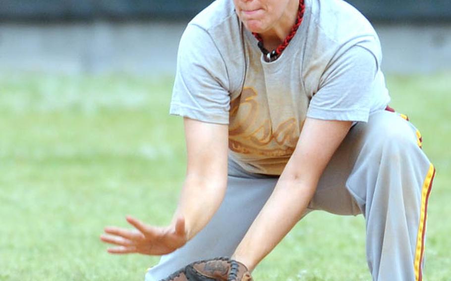 Osan Air Base shortstop Erin Moretti fields a ground ball by Kyungnam, Korea's national team, during Monday's women's double-elimination championship games.