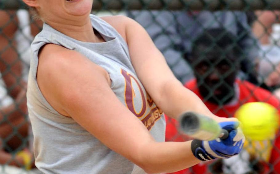 Osan Air Base batter Roz Breedlove tees off on a pitch from Kyungnam, Korea's national team, during Monday's women's double-elimination championship games.