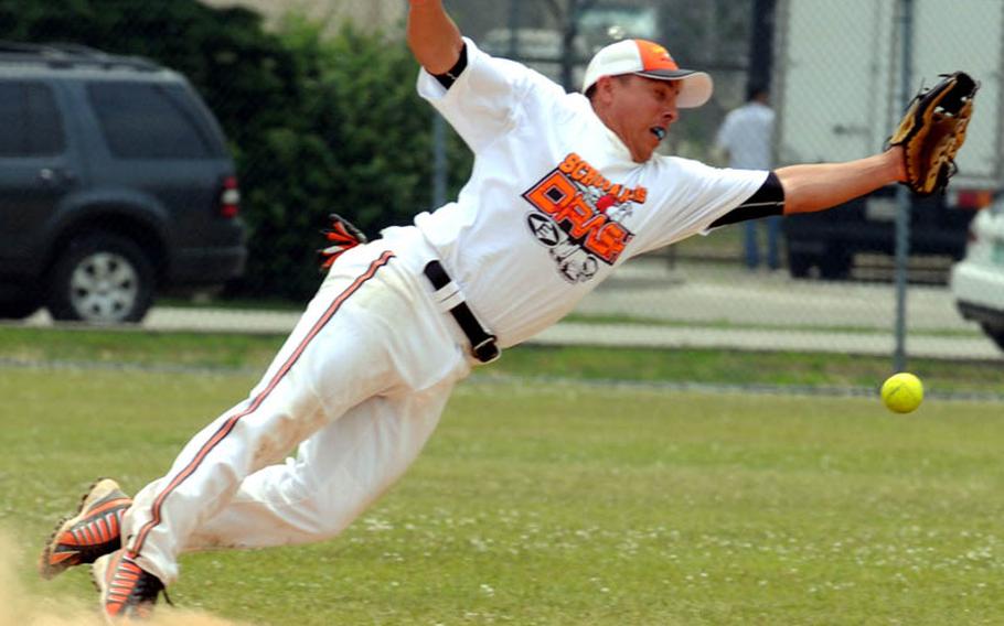 Scrapalators' All-Armed Forces infielder Gabe Beltran can't find the handle on an American Legion hit during Monday's men's best-of-three championship series in the 21st Pacificwide Open Interservice Softball Tournament at Yongsan Garrison, South Korea. Scrapalators beat Legion 31-30 and 33-16 for their first title in this tournament.