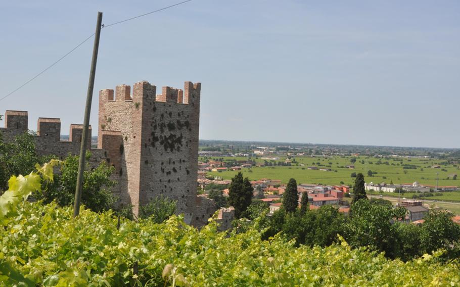 Vineyards surround a section of the walls that in turn surround the city of Soave, Italy --  known now as much for its wine as its walls.